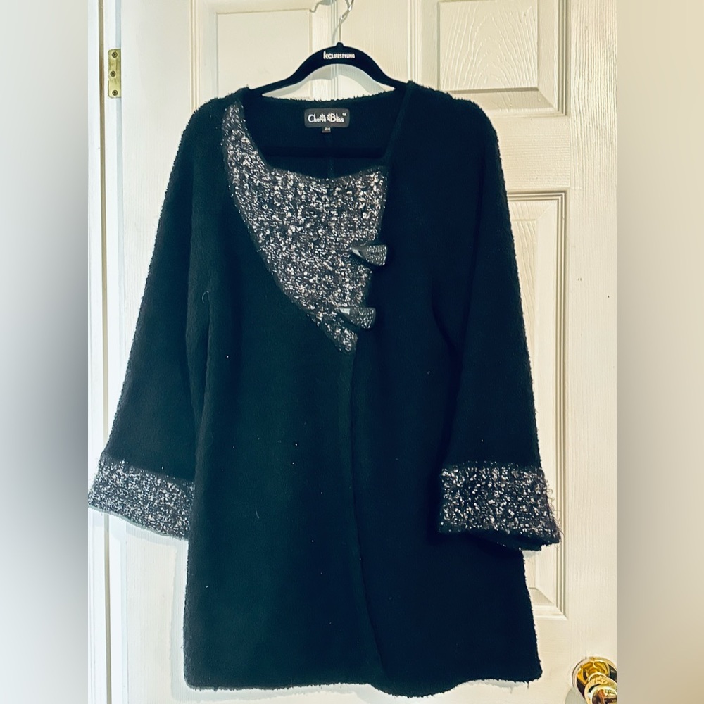 Black sweater  with two buttons.